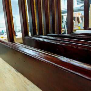 Refined wooden window frame restoration process for historic buildings.