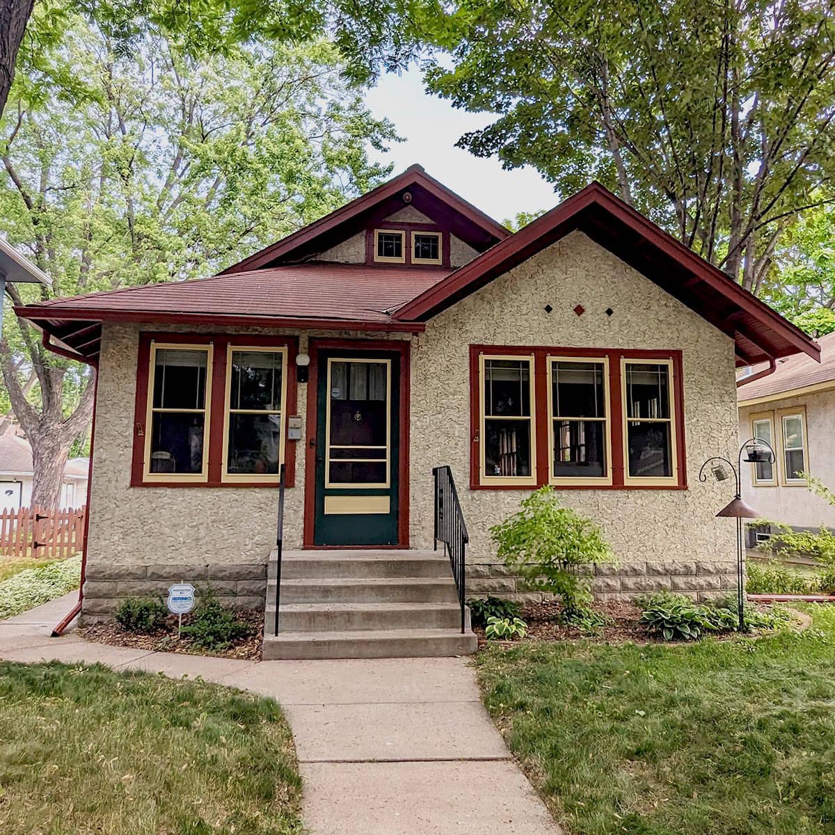 Restored vintage house with new window frames, demonstrating expert Hayes Window Restoration services.