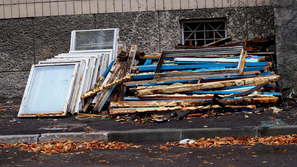 Discarded window frames and broken glass for Hayes Window Restoration project.