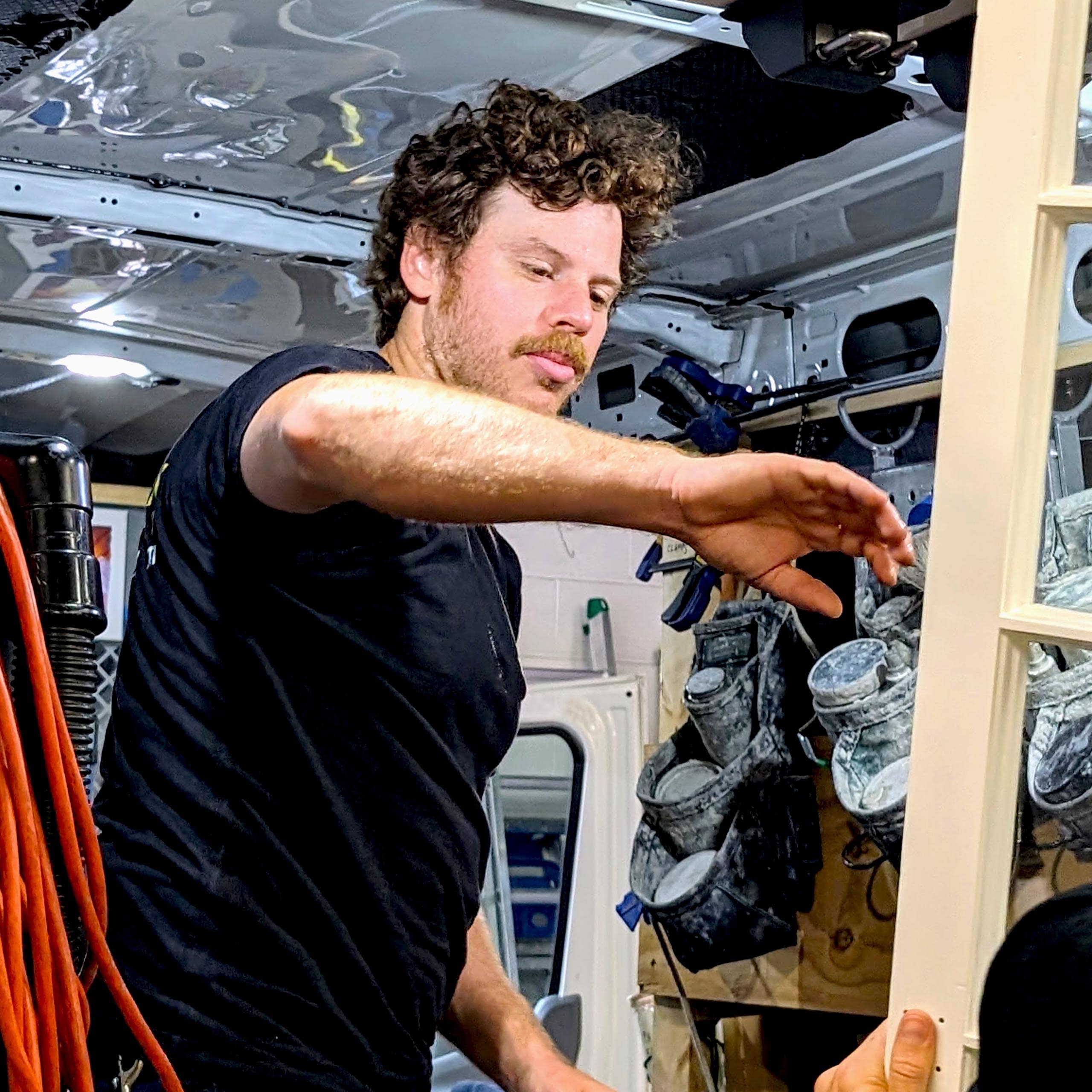 Vintage window restoration expert working on wooden window frames.