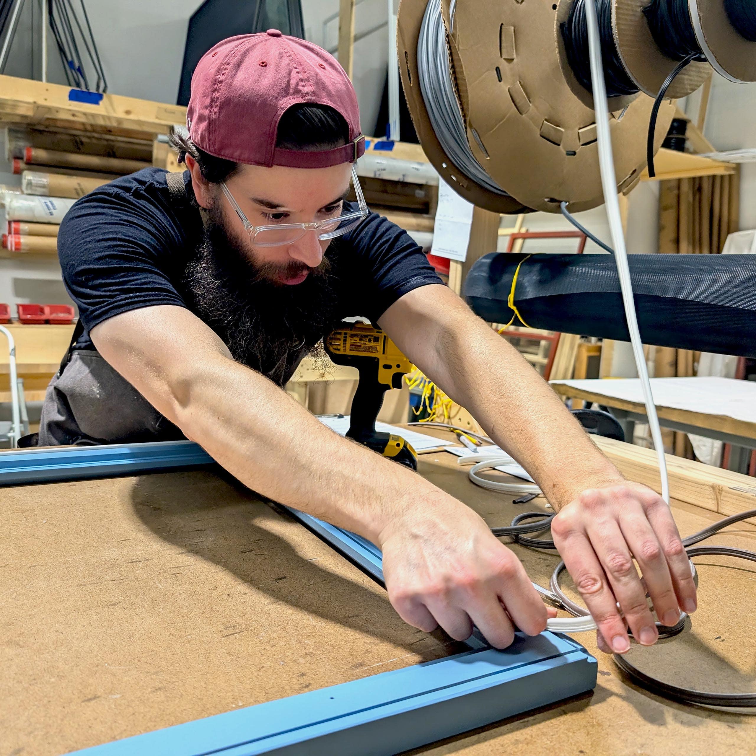 Replacing window glass at Hayes Window Restoration, professional window repair and restoration process.