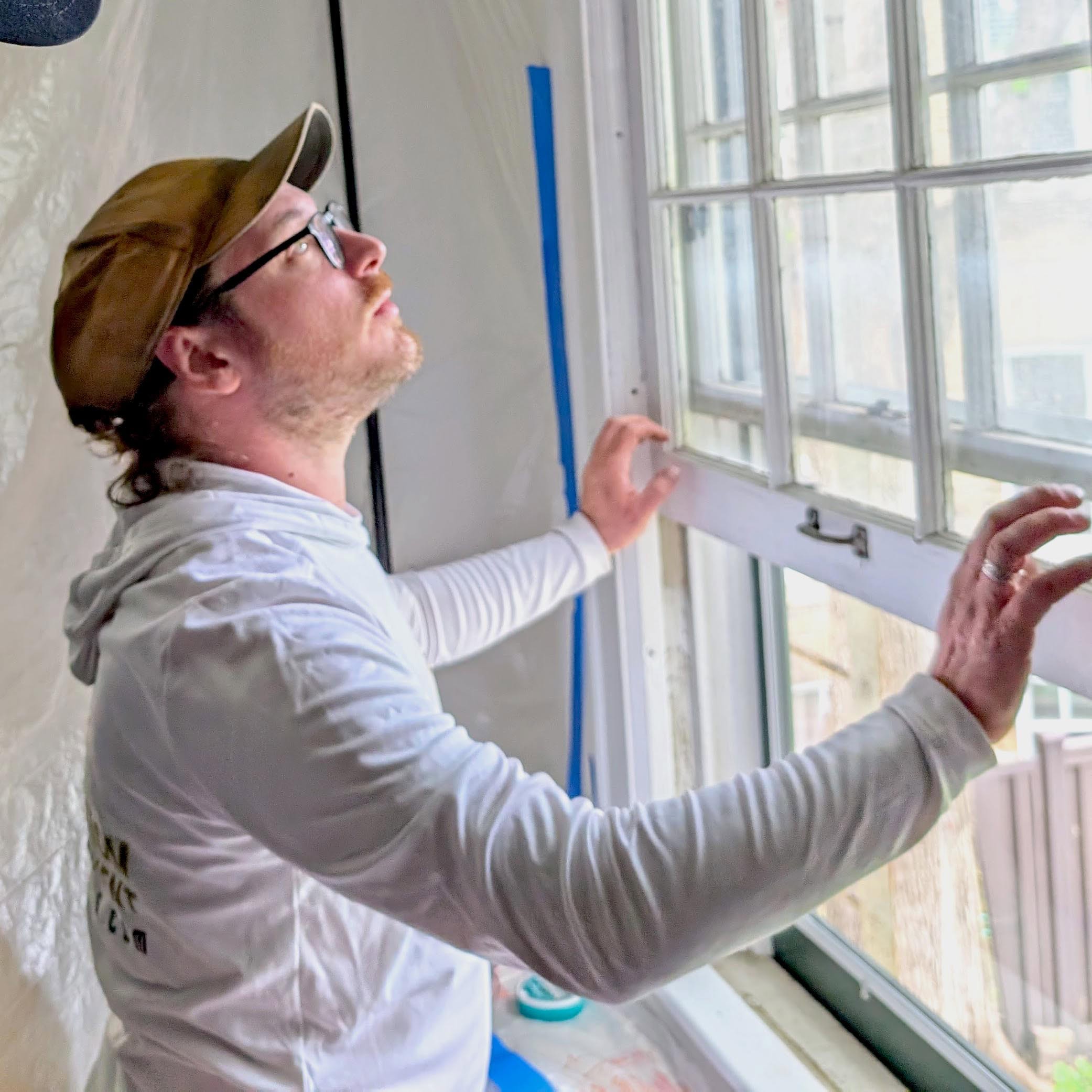Restoring historic wooden windows during a window restoration project at Hayes Window Restoration.