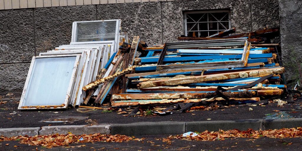 Discarded window frames and broken glass for Hayes Window Restoration project.